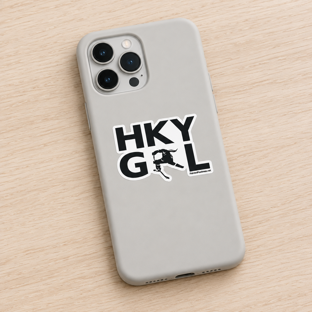 A light gray phone case with a black and white 'HKY GRL' (Hockey Girl) sticker design, shown on a light wood background.