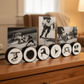 A set of hockey-themed photo frames displaying in hockey pucks that spell out a custom name in unique hockey letters displayed on a wooden dresser in a warm, softly lit living room. The set includes three vertical black-and-white hockey player photos standing behind round discs printed with hockey silhouettes and letters.