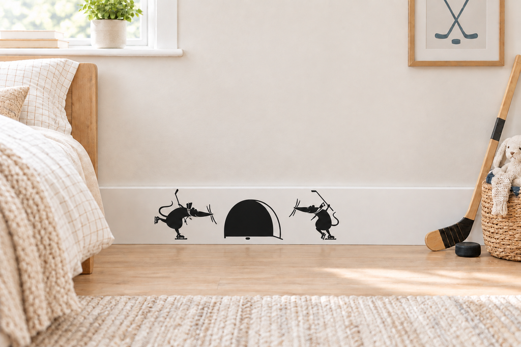 A decal of two mice playing hockey and shooting the puck at a mouse hole instead of a net.  This is placed on the baseboard in a kid's bedroom.  It's a very light and airy bedroom with hockey decor.