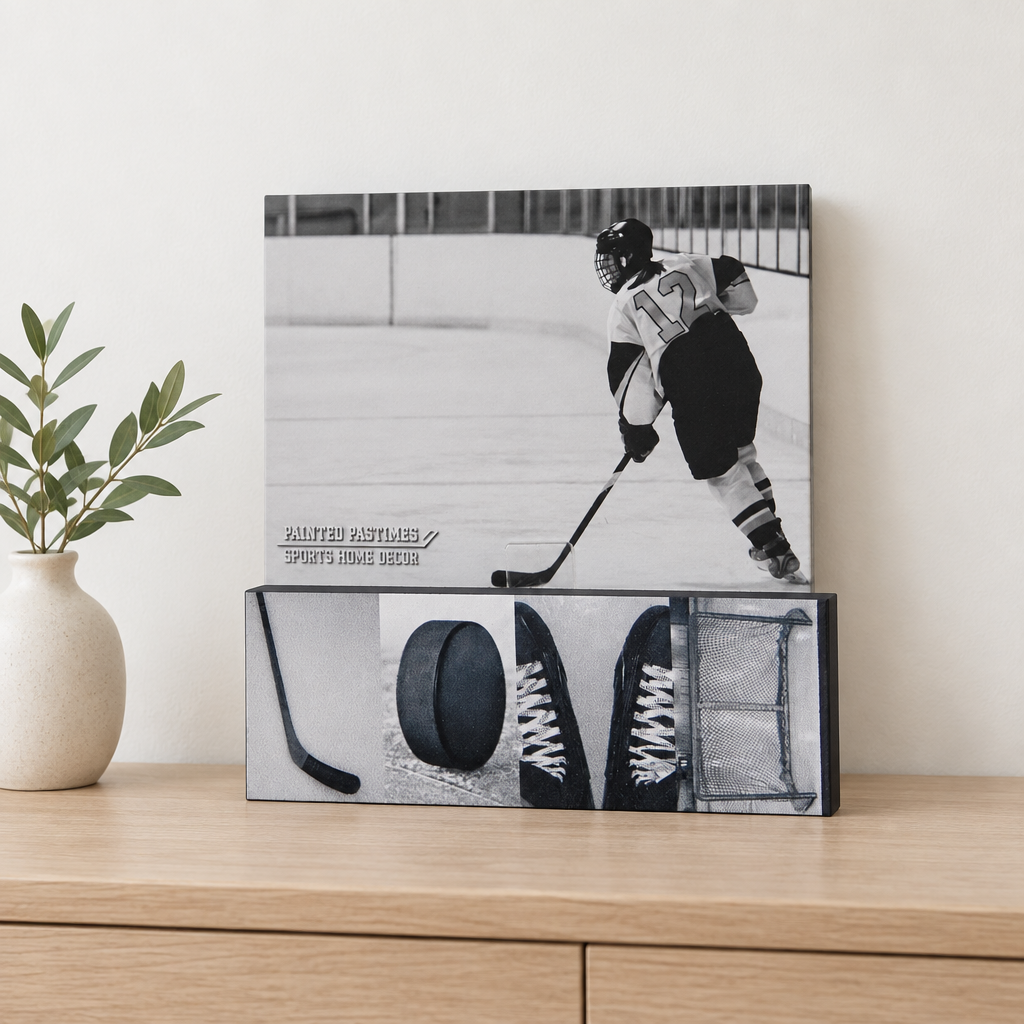 A hockey photo sign with the word "LOVE" spelled out with hockey photos displaying a hockey photo.  This sits on a natural wooden table along with a vase and greenery.