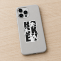 A light gray phone case with a black and white hockey-themed graphic sticker, shown on a light wood surface.