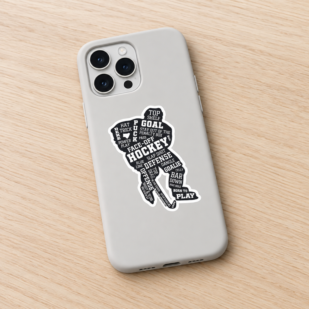 A light gray phone case featuring a black hockey player silhouette filled with words like 'GOAL', 'HOCKEY', 'DEFENSE', and 'PLAY' on a light wood background.