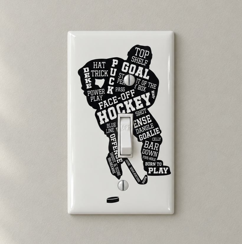 A white single-toggle light switch plate decal featuring a black hockey player silhouette filled with hockey-related words and phrases, shown on a light beige wall.