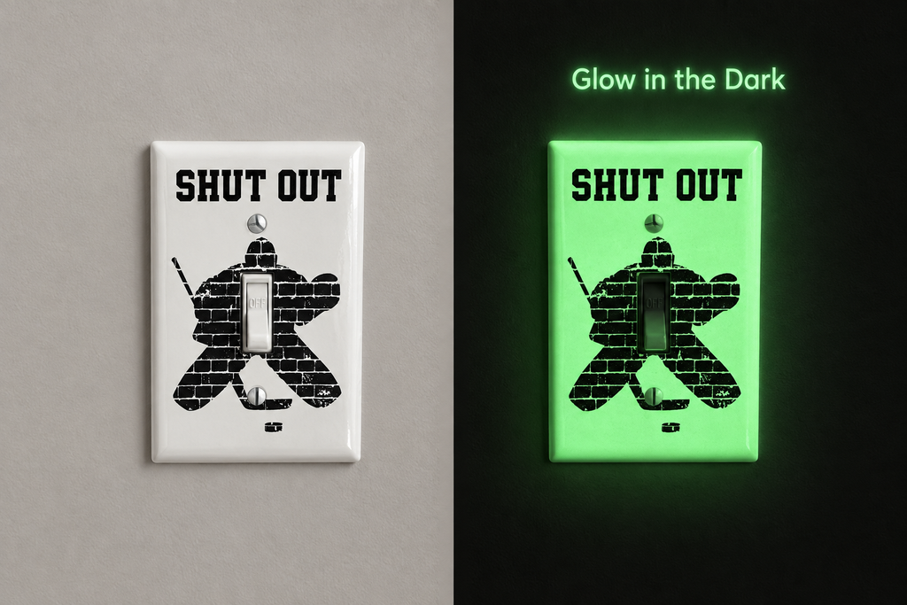 Light switch decal of a hockey goalie made of bricks and the words SHUT OUT.  This shows the decal in the daylight and in the dark when it glows in the dark.