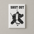 A white single light switch plate cover featuring a black hockey goalie graphic made of brick textures and the distressed text 'SHUT OUT' above it, shown on a white background.