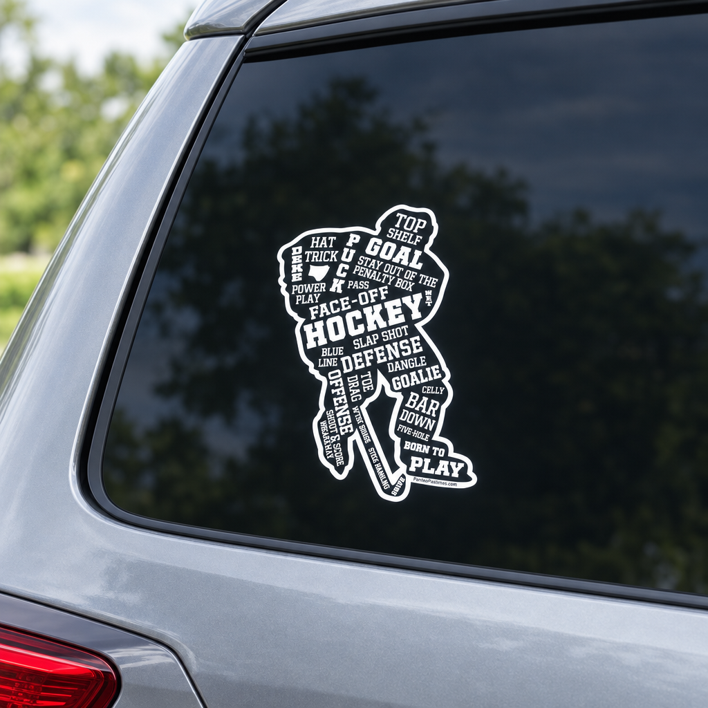A black and white vinyl decal shaped like a hockey player, filled with words related to the sport such as 'GOAL', 'FACE OFF', 'HOCKEY', and 'DEFENSE', applied to the back window of a silver vehicle.